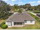 Aerial view of the home and backyard from above the roofline at 13800 Wellington Ln, Grand Island, FL 32735