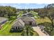 Stunning single-story home with manicured landscaping and circular driveway at 13800 Wellington Ln, Grand Island, FL 32735