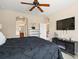 Spacious main bedroom with a fireplace and large television at 13800 Wellington Ln, Grand Island, FL 32735