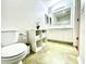 A clean bathroom featuring a white sink, white cabinet with shelves, and a large mirror at 1416 Lindsey Ln, The Villages, FL 32159