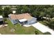 Charming blue single-story home with well-manicured lawn and attached one car garage at 1416 Lindsey Ln, The Villages, FL 32159