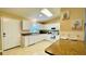 A bright kitchen featuring white appliances and a pantry at 1416 Lindsey Ln, The Villages, FL 32159