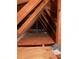 View of the attic with wood beams and insulation at 15912 Lake Orienta Ct, Clermont, FL 34711