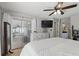 Bedroom featuring sliding glass door access and an en-suite bathroom at 15912 Lake Orienta Ct, Clermont, FL 34711