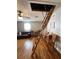 Cozy living room featuring a wooden ladder leading to the attic at 15912 Lake Orienta Ct, Clermont, FL 34711