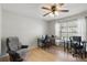 Home office with light wood floors, a ceiling fan and natural light from the window at 15912 Lake Orienta Ct, Clermont, FL 34711