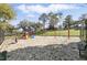 Community playground with swings, slides, and climbing structures, perfect for Gathering fun at 15912 Lake Orienta Ct, Clermont, FL 34711