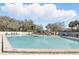 Sparkling community pool with ample lounge seating for relaxation and enjoyment at 15912 Lake Orienta Ct, Clermont, FL 34711