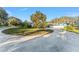 Beautiful front yard with circular driveway and mature landscaping at 16011 Acorn Cir, Tavares, FL 32778