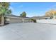 Spacious three-car garage and expansive driveway offers ample parking for homeowners and guests at 16011 Acorn Cir, Tavares, FL 32778