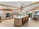 Open kitchen design with an island that offers seating for gathering and entertaining at 16011 Acorn Cir, Tavares, FL 32778