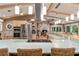 Kitchen with stainless steel appliances and an island overlooking living areas at 16011 Acorn Cir, Tavares, FL 32778