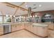 Open kitchen boasts updated appliances, ample counter space, and scenic water views at 16011 Acorn Cir, Tavares, FL 32778