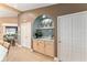Open concept kitchen area with a custom wet bar, perfect for entertaining at 16011 Acorn Cir, Tavares, FL 32778