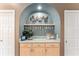 Custom wet bar area in the kitchen, perfect for entertaining and mixing drinks at 16011 Acorn Cir, Tavares, FL 32778