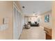 Bright living room boasts tile floors, ceiling fan, and closet storage space at 16011 Acorn Cir, Tavares, FL 32778
