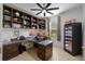 Spacious home office with built-in bookshelves and wine cooler at 16620 Caravaggio Loop, Montverde, FL 34756