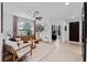 Comfortable living room with modern ceiling fan, neutral color palette, and lots of natural light at 16620 Caravaggio Loop, Montverde, FL 34756