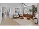 Inviting living room with large area rug, neutral color palette, and lots of natural light at 16620 Caravaggio Loop, Montverde, FL 34756