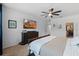 Stylish main bedroom with mounted television, walk-in closet, and neutral tones at 16620 Caravaggio Loop, Montverde, FL 34756