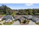 Aerial view of a well-maintained home and yard, highlighting its landscaping and neighborhood setting at 16801 Se 74 Soulliere Ave, The Villages, FL 32162