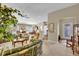 Spacious living room featuring neutral walls, bright light, ceiling fan, and open floor plan at 16801 Se 74 Soulliere Ave, The Villages, FL 32162