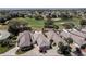 Aerial view of the community showcasing the meticulously landscaped surroundings and golf course at 1802 Dalton Dr, The Villages, FL 32162