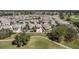 Scenic aerial shot of a residential area near a golf course, showcasing walking paths at 1802 Dalton Dr, The Villages, FL 32162