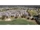 Overhead view of houses nestled around a golf course in a meticulously planned residential community at 1802 Dalton Dr, The Villages, FL 32162