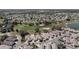 Beautiful aerial shot of a well-maintained residential area with a lush golf course and verdant trees at 1802 Dalton Dr, The Villages, FL 32162