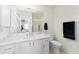 Bathroom featuring a white vanity with a marble countertop and a large mirror at 1802 Dalton Dr, The Villages, FL 32162