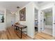 Hallway features a table with decor and doorway views of the bedroom and bathroom at 1802 Dalton Dr, The Villages, FL 32162