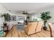 Living room with wood floors, seating area, and large window at 1802 Dalton Dr, The Villages, FL 32162