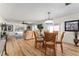 Living room with wood floors, sliding doors and comfortable seating at 1802 Dalton Dr, The Villages, FL 32162