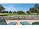 The brick patio features comfortable seating, inviting residents to relax and enjoy the scenic golf course views at 1802 Dalton Dr, The Villages, FL 32162