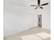 Bright bedroom featuring a ceiling fan, closet and attached bath at 2046 Dalecroft Trl, The Villages, FL 32162