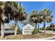 Welcome to Village of Buttonwood; a picturesque community awaits behind a charming flower-lined sign at 2046 Dalecroft Trl, The Villages, FL 32162