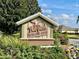 FishHawk Recreation Center sign amid lush greenery, inviting relaxation and recreation at 2046 Dalecroft Trl, The Villages, FL 32162