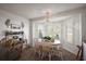 Breakfast nook features white shutters, pendant lighting, and seating for four at 2114 Gerardo Ave, The Villages, FL 32159