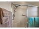 Accessible shower with a hand-held shower head, seating, and safety bar at 2114 Gerardo Ave, The Villages, FL 32159