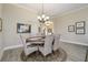 Cozy dining room with decorative chandelier, and ample space for a comfortable meal at 2124 Biller Cir, The Villages, FL 32163