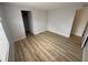 Cozy bedroom with closet for storage, wood-look floors, and light wall colors at 22 Big Tree Dr, Fruitland Park, FL 34731