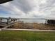 View of the lake, docks, and surrounding areas from the enclosed porch of the home at 22 Big Tree Dr, Fruitland Park, FL 34731