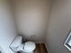 Neutral-toned toilet in a small room at 22 Big Tree Dr, Fruitland Park, FL 34731