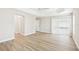 Bedroom with wood-look flooring, white walls, and ceiling fan at 2311 Bramble Ter, The Villages, FL 32162