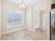 Bright breakfast nook featuring a large arched window and tile flooring at 2311 Bramble Ter, The Villages, FL 32162