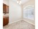 Bright breakfast nook featuring a large arched window and tile flooring at 2311 Bramble Ter, The Villages, FL 32162