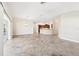 Open-concept living room with tile floors seamlessly connects to the kitchen at 2311 Bramble Ter, The Villages, FL 32162