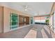 Large screened-in porch with a view through the home's interior at 2311 Bramble Ter, The Villages, FL 32162