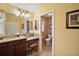 Bathroom featuring vanity with a makeup counter and a separate toilet room at 2360 Unity Ter, The Villages, FL 32162